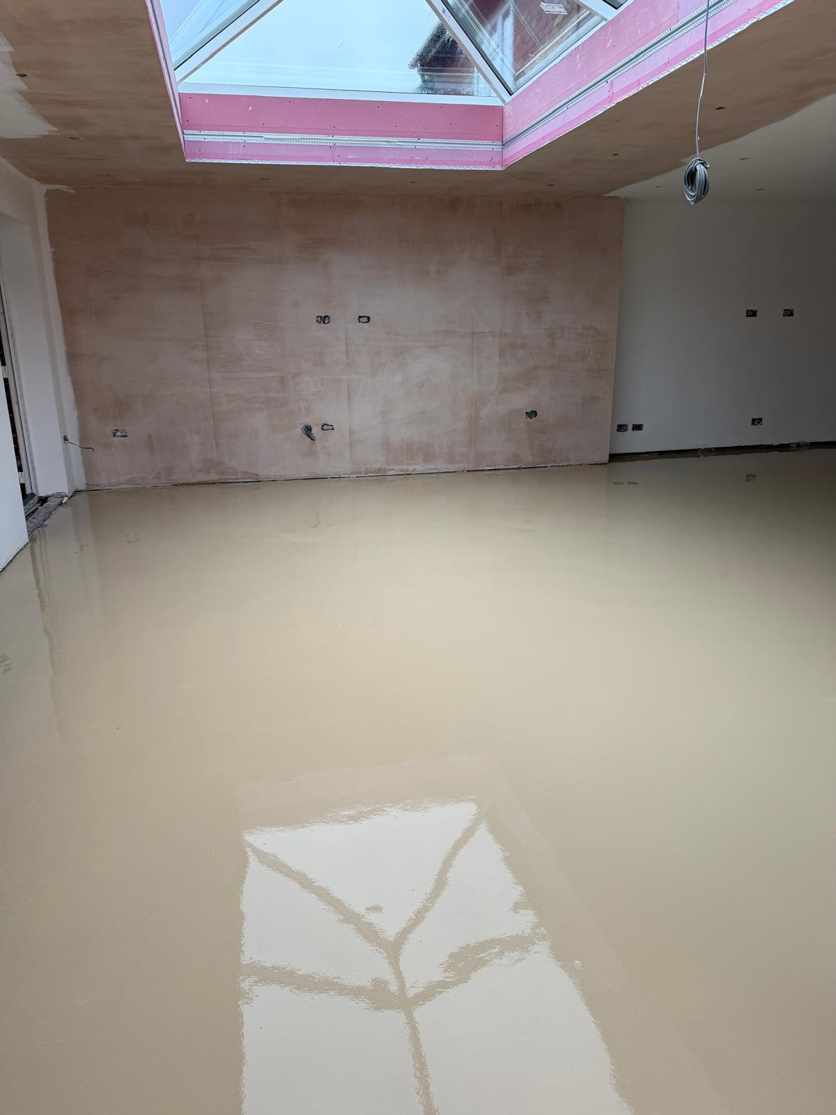 Milled screed channels with dust-extracted finish ready for UFH pipe